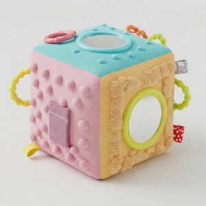 A 10-month-old baby using a colorful bear-shaped toy walker to support crawling and walking development.