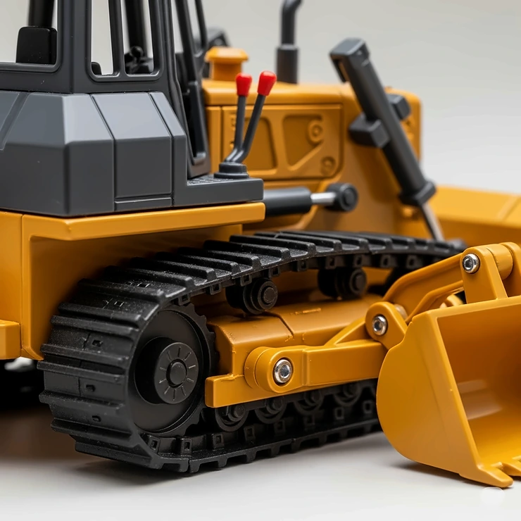 Close-up view of the detailed tracks and functional design of a miniature dozer toy, emphasizing its realistic features for play.
