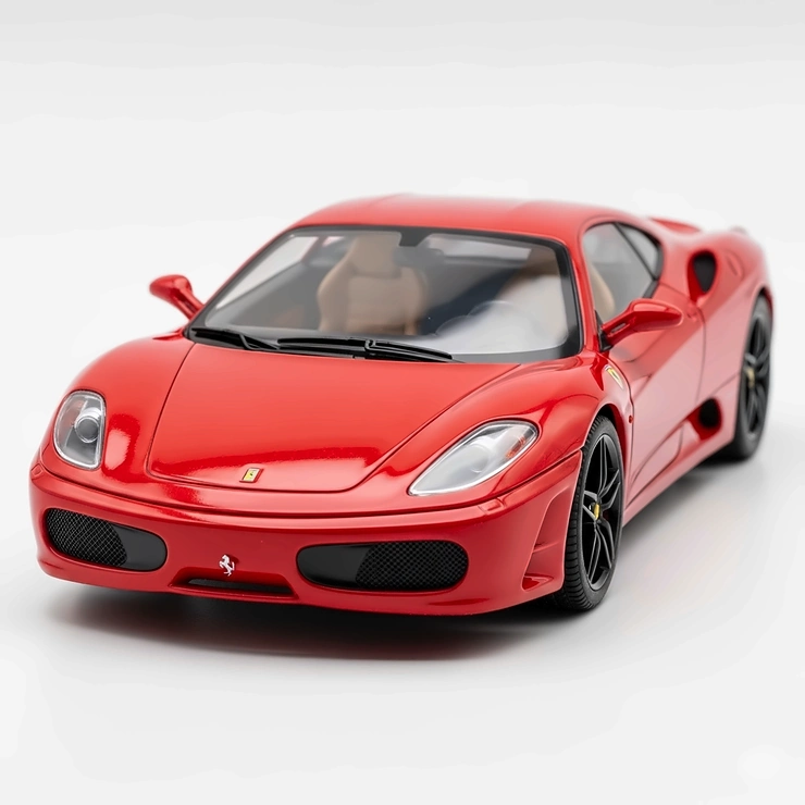A detailed red toy Ferrari sports car on a white background.