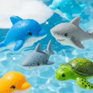 A collection of soft, floating ocean animal toys, such as a dolphin, shark, and turtle, perfect for bath time or pool play.