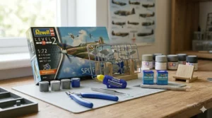 A photorealistic 4K wide shot of an impeccably organized hobby workstation prepared for a beginner's first project, featuring an unopened Revell Level 2 Spitfire kit and tools arranged on a cutting mat.