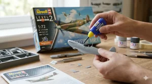 A photorealistic close-up of a beginner’s hands assembling a Revell Level 2 Spitfire model airplane, carefully applying Revell Contacta Professional glue to plastic parts.