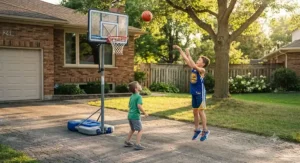 Kids playing basketball on an adjustable driveway hoop with a mini rubber basketball.
