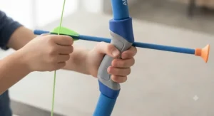 A child's hands gripping the ergonomic handle of a colorful foam bow designed specifically for small hands.