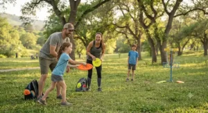 Family having fun playing a round of disc golf together on a family-friendly course.