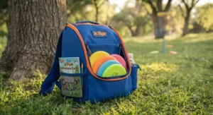Compact kids disc golf backpack filled with miniature discs and a scorecard.
