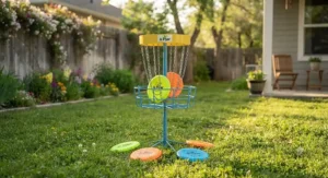 Portable youth disc golf basket with colorful lightweight discs set up on a backyard lawn.