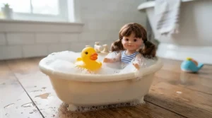 A baby doll with accessories for toddlers set up for imaginative bath time routines.